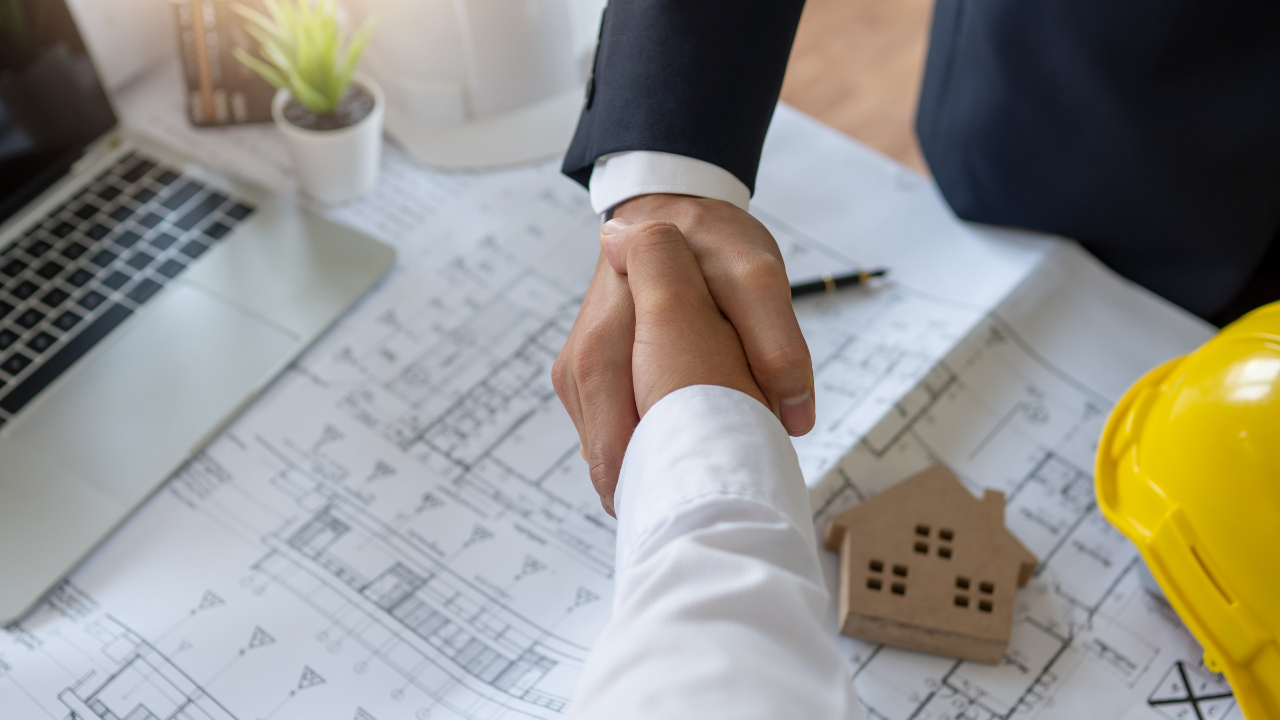 First home builders reviewing construction plans
