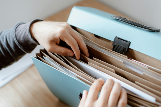 Tradie sorting loan documents — comparing paperwork for cashflow vs business loan options. Tradie sorting loan documents — comparing paperwork for cashflow vs business loan options.