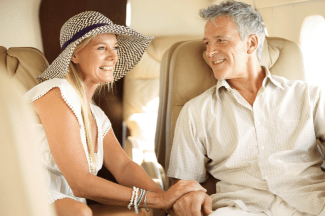 Wealthy couple travelling — lifestyle shaped by strategic property investing in Australia.