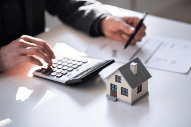 SMSF trustee calculating loan repayments — balancing debt strategy with liquidity needs.