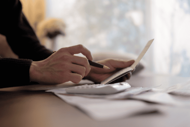 SMSF trustee reviewing expenses — planning property tax and negative gearing strategy.