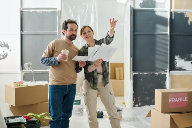 Couple planning home renovations using home equity to improve living space