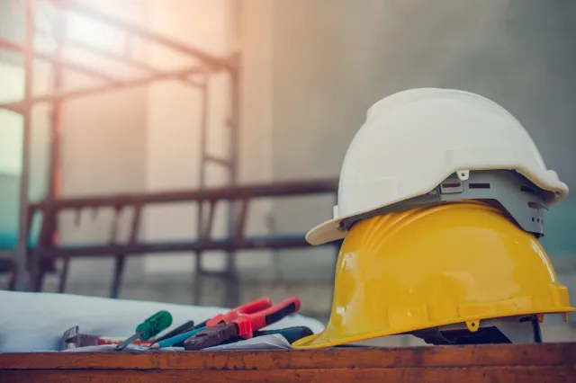 Builder and homeowner reviewing plans for a knockdown rebuild
