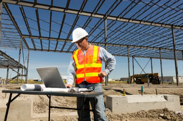 Self-employed tradie reviewing documents for a low-doc business loan
