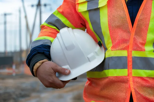 Owner-builder reviewing plans and finance for a building project